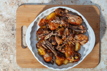 baked chicken legs with potato. Homemade freshly baked food. Crispy chicken with baked potatoes.