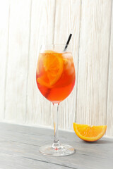 Aperol spritz cocktail on wooden background. Summer drink