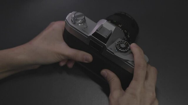 hands shooting 35mm analog camera