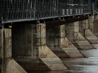 Dam columns and bridge over river