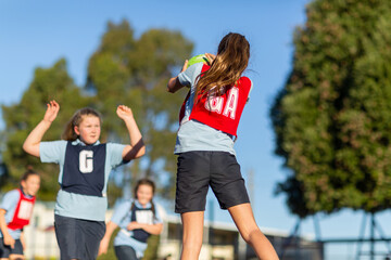 School girls playing netball