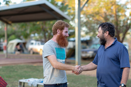 Two men meeting and shaking hands