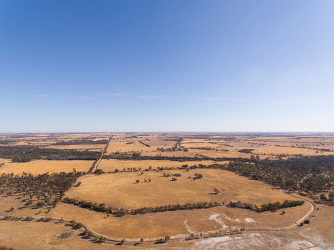 Aerial view over flat farmland