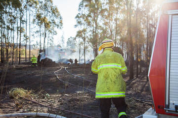 Fire and rescue fireman beside red a firetruck