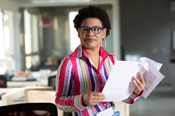 afro brazilian business woman working alone in office