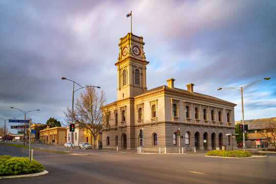 Moving clouds over a rural town intersection with an historic post office