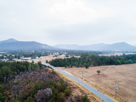Bulga bridge and smoke filled sky over the hills and rural town