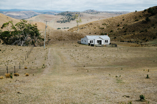 Lone White House In Paddock In Central Highlands Tasmania