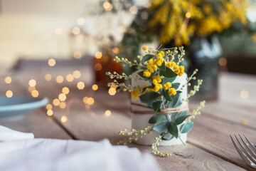table decor with wattle sprig on a candle