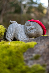 Jizo Buddhist statues with red cap at Daisho-in Temple, Miyajima, Japan - Daishoin Temple is known for it's over 500 statues in different shapes and sizes. Hidden wonder on Miyajima's Mount Misen.