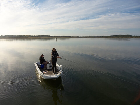 Casting a Lure from a Boat While Fishing