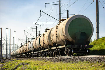 Fototapeta na wymiar Transportation of crude oil in barrels by rail.