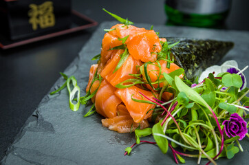 Temaki sushi. Traditional Japanese cuisine, premium salmon Temaki decorated in an elegant setting.