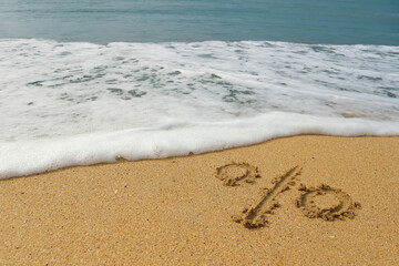 The percent sign is drawn on the beach by the sea, right next to the water. The wave washes away the percent sign. Concept period discounts on tours to the sea ends soon.