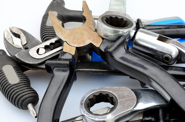 assorted pliers and tool on white background