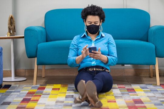 Afro Brazilian Business Woman In Mask Alone In The Modern Office