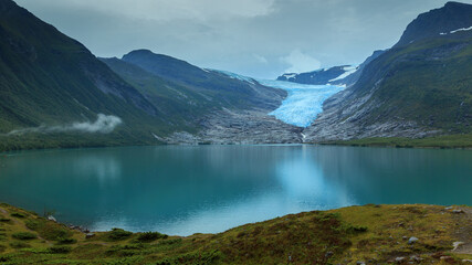 Fototapeta na wymiar Svartisen Glacier landscape with ice, mountains and sky in Norway