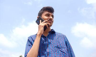 Teen man busy in phone. handsome young man.