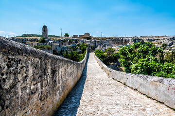 Fototapeta premium A view across the Roman bridge in Gravina, Puglia, Italy