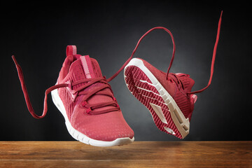 Flying in the air pink running sports shoes. Abstract shopping concept. Levitation sports shoes...