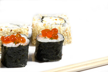 close up of sushi roll on the white background , eating sushi roll in restaurant, selective focus. Copy space