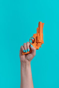 Hand holding a gun