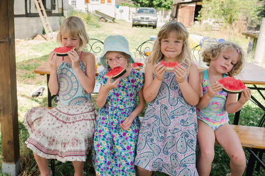 little blonde girls eating watermelon