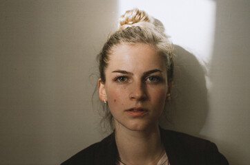 Close up portrait of a beautiful woman looking at camera. Film photo 35mm