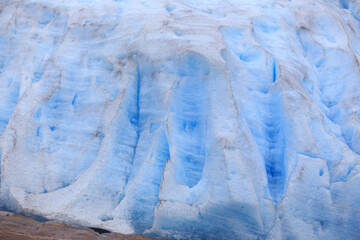 Svartisen Glacier landscape, white and blue ice in the rocky mountains