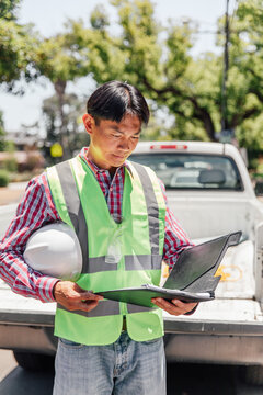 Man Working Outside Reads