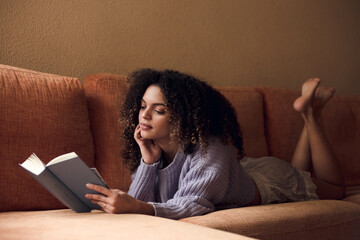 Female student reading at home