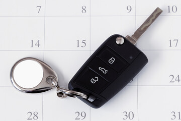 Blank Metal Car Key with Blank Empty Keychain Mockup on Calendar.