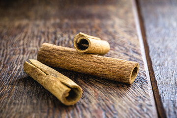 bark cinnamon cut into small piles. Cinnamon, culinary spice.