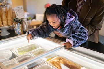 Girl choosing ice cream flavor