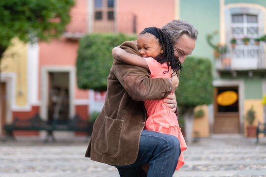 Father and daughter hug