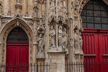 Fragment of Paris Gothic style Church of Saint-Merri (Eglise Saint-Merry, XVI) at street Rue Saint Martin. Paris, France.