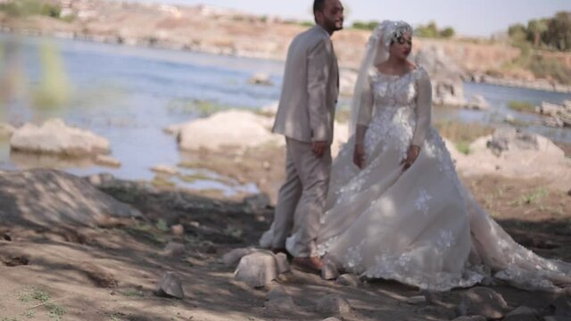 Muslim wedding couple in love on The shore of the river
