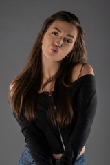 Girl posing on black background. Isolated