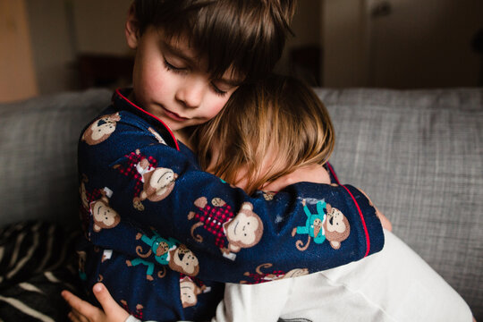 brother and sister hug