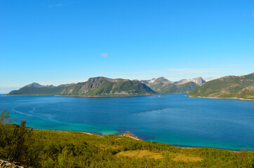 summer landscape with majestic mountanis and deep blue fjords