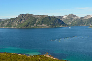Fototapeta na wymiar summer landscape with majestic mountanis and deep blue fjords