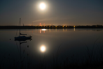 Lake at night, moon light lake and yaht. Lake pogoria in Dabrowa Gornicza Poland