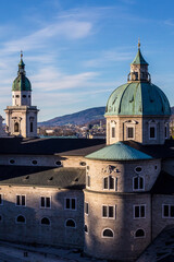 Fototapeta na wymiar View of Salzburg Rooftops and Salzburg Cathedral (Salzburg Dom) from Hohensalzburg Fortress