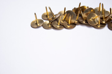 golden pins. stationery concept. copy space. isolated. High quality photo
