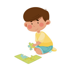 Little Boy Sitting and Putting Together Jigsaw Puzzle Vector Illustration
