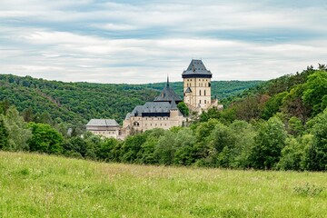 Fototapeta na wymiar Beautiful view of Gothic castle Karlstejn. Medieval castle was built in gothic style by king and emperor of old Roman rise, Charles IV. It is situated in central Bohemia near Prague - Czech Republic