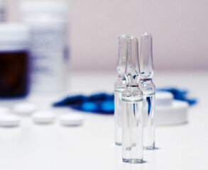 Medical ampoules on the pharmacy background