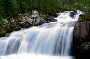 Obraz premium majestic mountain waterfall in northern norway