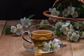 Fresh white jasmine flowers on a wooden table. Jasmine tea.