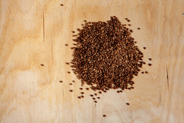 Photo food buckwheat groats. Texture background grain buckwheat groats.Diet concept. Background texture of buckwheat. Image food product porridge buckwheat grains